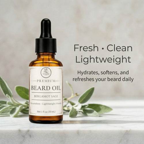 Bottle of beard oil with dropper on a marble surface with sage leaves, labeled 'Fresh Clean Lightweight'.