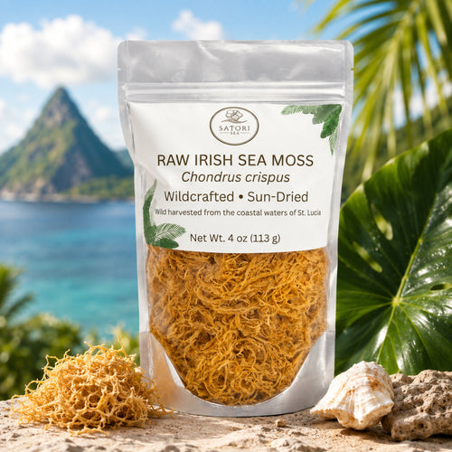 A stand-up pouch of Satori Sea Moss Raw Irish Sea Moss Chondrus crispus, displayed on a beach with a tropical island background, seashells, and a small pile of the dried moss in front.