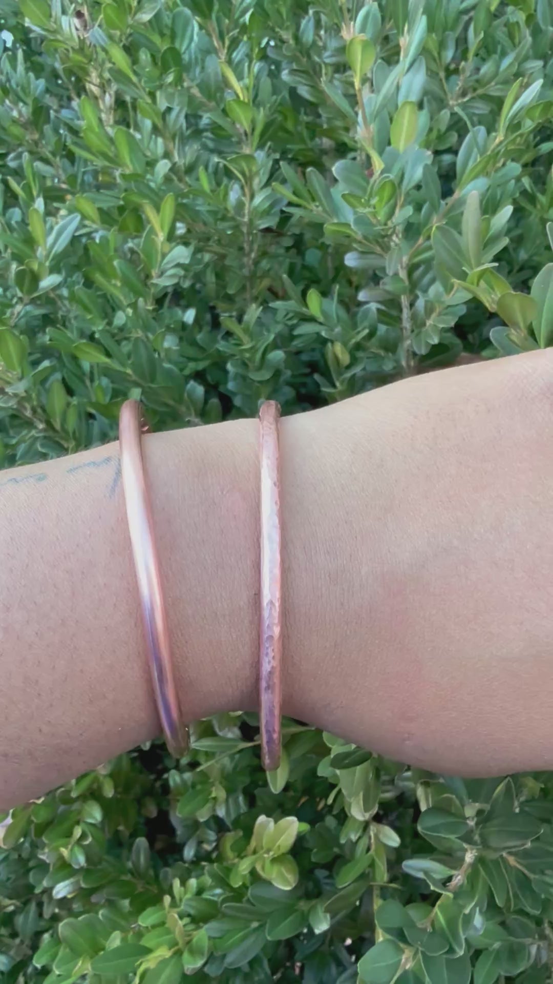 video showing 2 copper cuffs on wrist